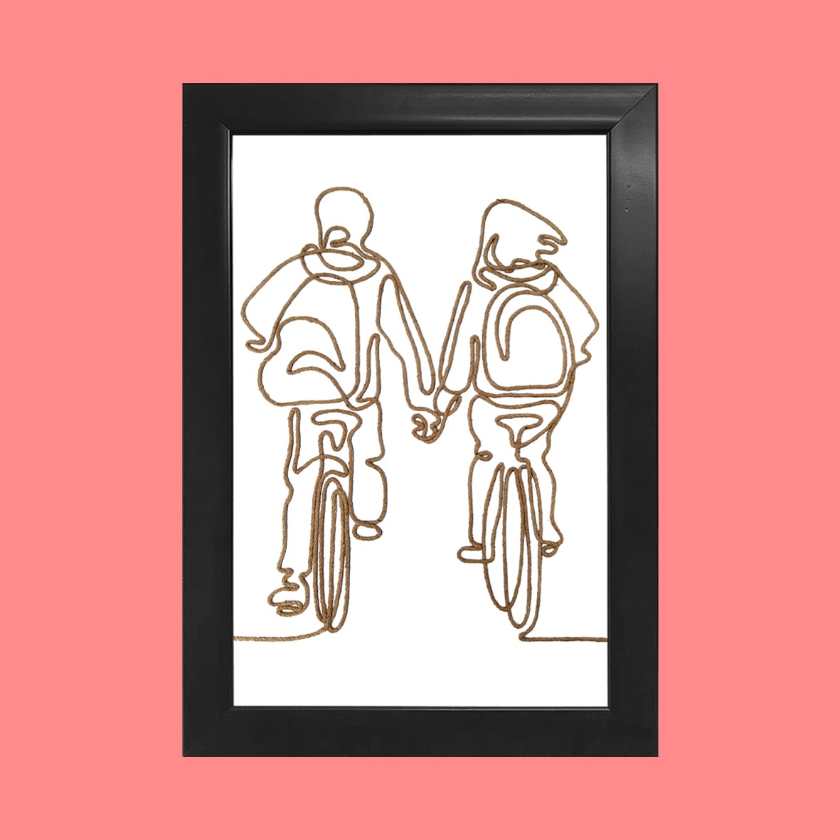 A handcrafted rope line art of a couple cycling together, framed in black, with a pink background.