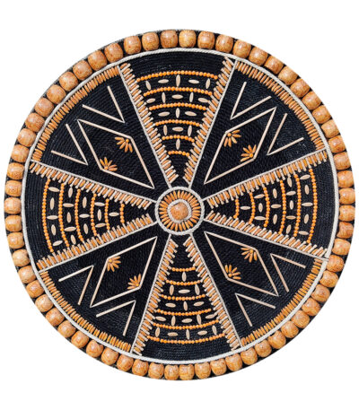A circular handmade wall hanging titled "Dhono Dhanno", crafted using paddy seeds, lentils, wooden beads, and jute thread on a black cotton rope and MDF board base, in a symmetric mandala pattern.