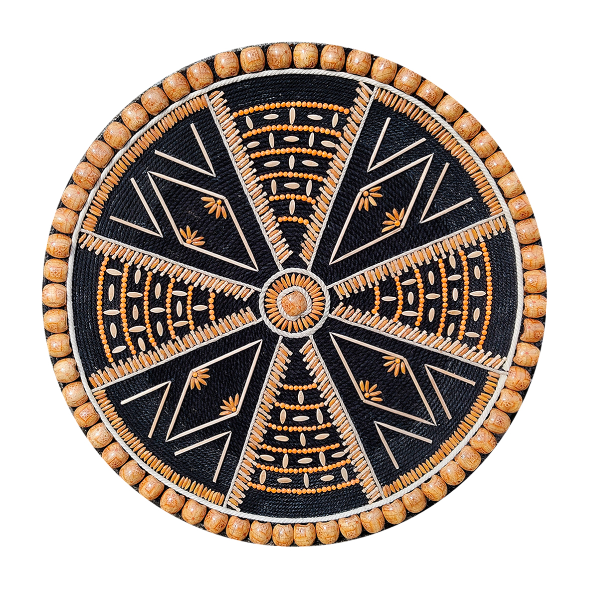 A circular handmade wall hanging titled "Dhono Dhanno", crafted using paddy seeds, lentils, wooden beads, and jute thread on a black cotton rope and MDF board base, in a symmetric mandala pattern.