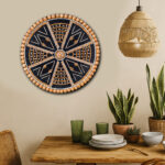 Handcrafted circular mandala wall hanging made with natural seeds, jute, shells, and wooden beads on black cotton rope base – Dhono Dhanno design by Upahar18