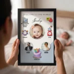 Close up real life shot of hands holding upahar18 personalized baby birth details classic photo frame design 004 with a blurred newborn baby sleeping in bed in the background