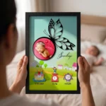 Close up real life shot of hands holding upahar18 personalized baby birth details classic photo frame design 014 with a blurred newborn baby sleeping in bed in the background