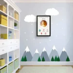 Upahar18 personalized baby birth details classic photo frame design 015 hanging on a light blue nursery wall with mountain and cloud wall stickers