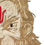 Macro close-up view of Upahar18 Bajrangbali Rope Craft Portrait Frame showing the fierce eye detail and vibrant red tilak made from intricately glued jute and cotton ropes.