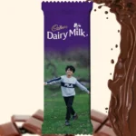 A customized Cadbury Dairy Milk bar wrapper by upahar18, showcasing a large personalized photo printed image of a boy playing outdoors across the entire lower half.