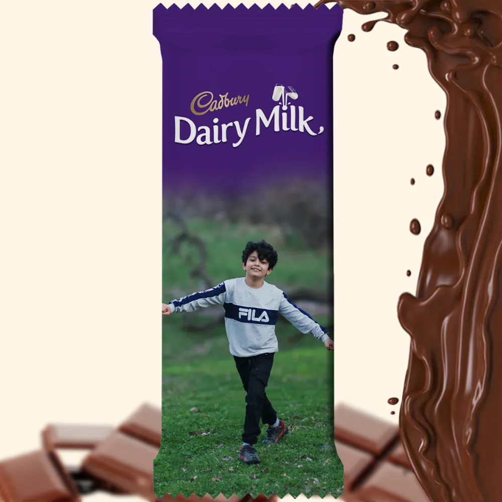 A customized Cadbury Dairy Milk bar wrapper by upahar18, showcasing a large personalized photo printed image of a boy playing outdoors across the entire lower half.