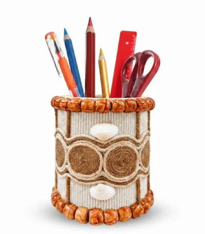 Studio shot of Upahar18 Handmade Eco-Friendly Rope Base Pen Stand against a clean white background. This artisanal desk organiser is packed with colorful pens, pencils, and office tools, showcasing its intricate seed flower emblem and terracotta-style wooden bead borders.