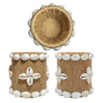 Product showcase of Upahar18 Handmade Eco-Friendly Rope Base Pen Stand from three views. The top angle displays the deep spiral jute rope interior cavity, while the two lower panels illustrate the uniform arrangement of white seashells and cowrie cross floral patterns wrapping around the desk organiser.