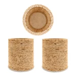A cylindrical handmade pen stand with an intricate woven basket texture resting on a polished dark wooden office desk. Captured under warm, dramatic studio lighting, the container holds colorful pencils, an orange pen, a red ruler, and scissors against a soft-focus background.