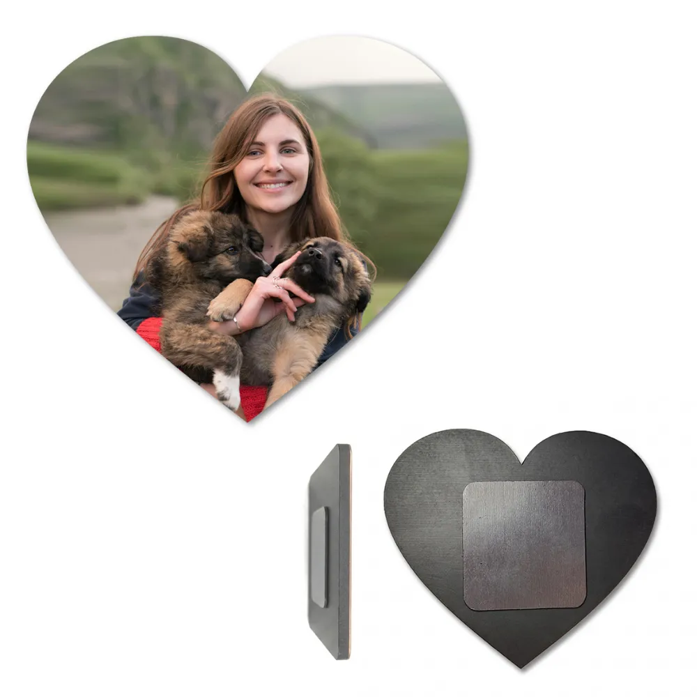 A multi-angle product display showcasing a heart-shaped personalized MDF fridge magnet with a photo of a smiling woman holding two small puppies. Below the main image, the side profile highlights its sleek thickness, and a full back view displays the solid dark wooden base with a powerful square magnetic sheet attached in the center by upahar18.