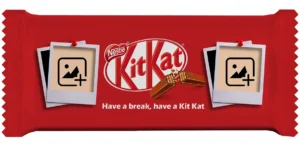 A horizontal red customized kitkat wrapper template by upahar18 featuring two separate empty polaroid photo frames pinned to the wrapper.