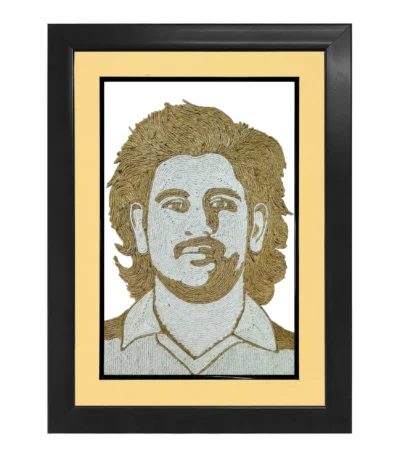 An elegant rope craft portrait of MS Dhoni featuring detailed jute artwork, enclosed in a premium black frame with a sophisticated cream-colored inner mount border.