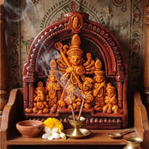 Upahar18 handcrafted Design 02 Terracotta Maa Durga Devi idol illuminated beautifully inside a home temple with incense smoke and a clay diya, made in Krishnanagar.