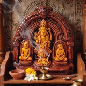 Handcrafted upahar18 Terracotta Maa Kali idol glowing inside a home puja temple with incense smoke, marigold flowers, and a traditional clay diya, made in Krishnanagar.