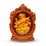Premium upahar18 handcrafted Terracotta Maa Saraswati idol holding a Veena in a decorative frame, crafted by heritage clay artisans of Krishnanagar.
