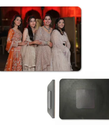 A product layout on a white background showing a landscape rectangle personalized MDF fridge magnet with a custom photo of four women in elegant traditional Indian bridal dresses at a wedding event. Below the photo, a side profile illustrates the wooden edge, and a full back view shows the rectangular black MDF base with a square magnet fixed in the center by upahar18.