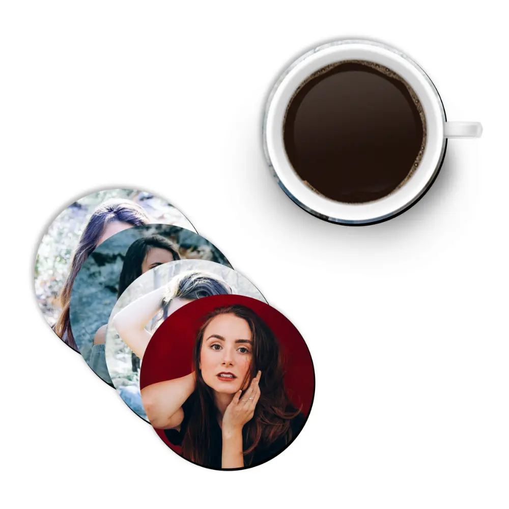 A top view of a stack of four round coasters from upahar18 printed with individual female portraits, paired with a white ceramic cup filled with black coffee.