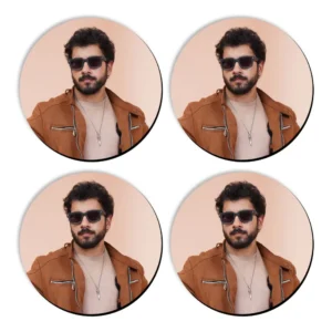 A 2x2 grid presentation of four individual circular MDF coasters by upahar18, each cleanly printed with the same high-quality custom photo portrait of a man wearing a brown jacket and dark shades.
