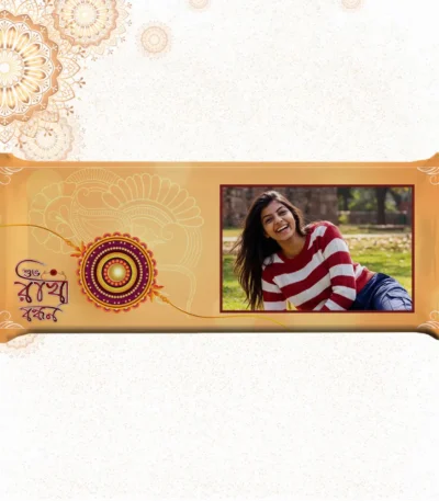 Horizontal custom Cadbury Dairy Milk by upahar18 featuring a golden rakhi theme customize design wrapper with a beautiful photo chocolate print of a smiling girl in a striped sweater.