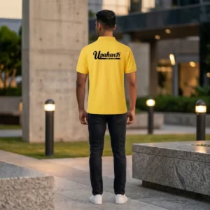 Back view of a male model wearing a yellow polo T-Shirt displaying the bold upahar18 brand name printed on the upper back.