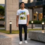 A male model posing outdoors wearing a white round neck mixed cotton T-Shirt from upahar18 featuring a vibrant landscape custom photo printed on the front.