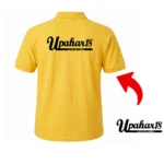 Back view of a yellow polo T-Shirt featuring the upahar18 print and crafts brand logo printed boldly across the upper back with a red arrow pointer.