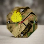 An octagon-shaped MDF clock from upahar18 resting on a wooden surface, displaying a vibrant printed custom photo of a yellow butterfly sitting on a rock.