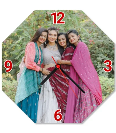 A crisp studio front view of an octagonal upahar18 Wall clock printed with a high-definition custom photo of friends in ethnic wear, isolated on a solid white background.