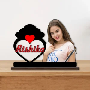 A vibrant personalized custom photo printed MDF cutout standee by upahar18 of a cloud and heart name portrait design, displayed beautifully on a smooth wooden tabletop surface against a neutral background.