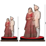 A product size comparison chart showing two different sizes, 8 inch and 12 inch, of the upahar18 personalized custom photo printed MDF cutout standee featuring a bride and groom theme to display available scaling options.