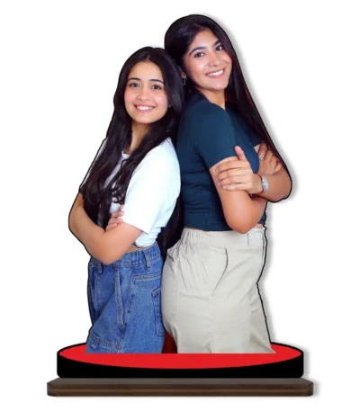 A personalized custom photo printed MDF cutout standee from upahar18 showcasing two smiling female friends standing back-to-back with arms crossed, isolated on a plain white background.