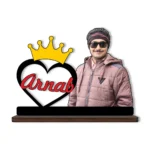 A high-definition printed MDF cutout standee by upahar18 featuring a personalized custom photo of a man next to a large black-bordered heart with a golden royal crown on top and the name "Arnab" printed inside in red, isolated on a white background.