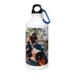 An isolated product view of a white 600 ml upahar18 Sipper Bottle beautifully printed with a custom photo of a speeding sports biker against a plain white background.