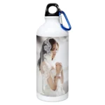 An isolated product shot of a white 750 ml upahar18 Sipper Bottle beautifully detailed with a printed custom photo of a bride in a white veil against a solid white background.