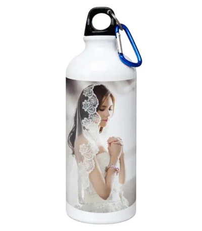 An isolated product shot of a white 750 ml upahar18 Sipper Bottle beautifully detailed with a printed custom photo of a bride in a white veil against a solid white background.