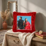 An aesthetic home decor display of a personalized red square fur cushion featuring a custom photo by upahar18.