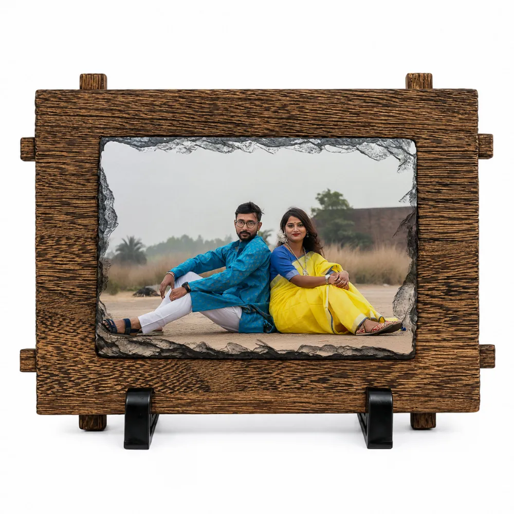 Upahar18 Rectrangle shape personalized photo printed rock stone frame 003a A straight front view of a horizontal rectangle shape natural rock stone frame from upahar18 on a white background. The frame showcases a personalized custom photo printed of a couple sitting back-to-back, highlighted by a dark chiseled stone edge and an outer faux-wooden textured frame border resting on twin black stands.