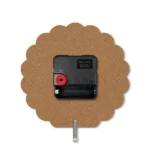 The back view of a wavy edge upahar18 MDF clock highlighting its raw brown fiberboard texture, a central black quartz movement box, and a silver metal stand pin.
