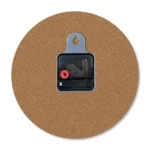 The back view of a circular upahar18 MDF clock showing its brown wood fiberboard back, a central black quartz movement box, and a built-in grey plastic wall-hanging slot.