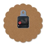 The back view of a wavy-edged upahar18 MDF clock highlighting its brown wood fiberboard backing, a central black quartz movement engine, and a plastic wall-hanging slot.