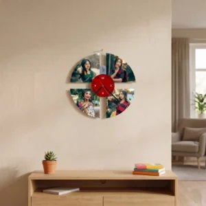 A unique 4-slot round collage MDF clock from upahar18 hanging on a beige wall above a wooden shelf console, showcasing a printed custom photo collection of a woman in traditional sarees around a central red dial.