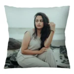 A close-up product shot of a 12x12 inch personalized square shape plain cushion featuring a woman's beach portrait from upahar18.