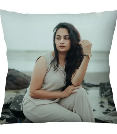 A close-up product shot of a 12x12 inch personalized square shape plain cushion featuring a woman's beach portrait from upahar18.
