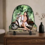A custom photo printed rock stone frame by upahar18 showcased on a polished wooden drawer cabinet. The bell-shaped personalized frame displays a colorful outdoor photograph and stands elegantly alongside a black vase with dried flowers against a soft-toned interior wall.