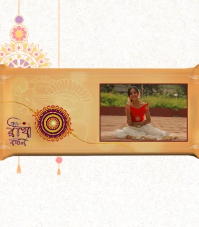 Horizontal custom Nestlé KitKat by upahar18 with a golden customize design wrapper showing a large rakhi emblem, Bengali typography, and a photo chocolate print of a smiling young girl in traditional attire.