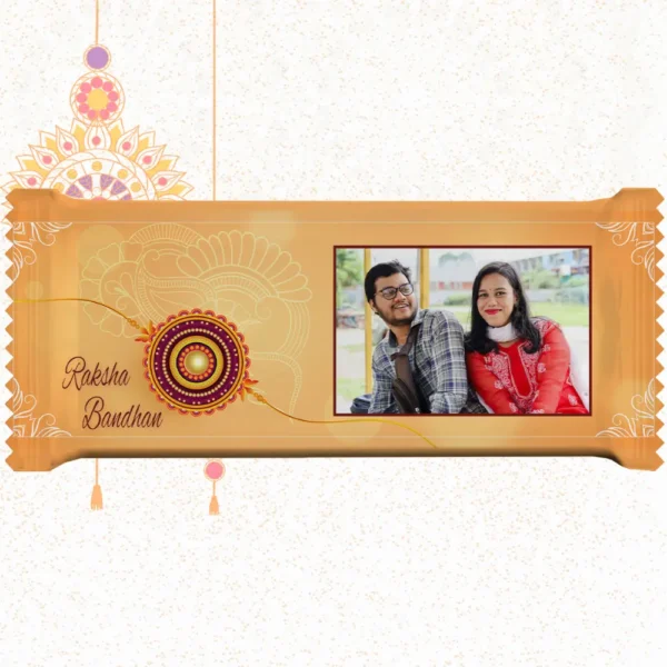 Horizontal custom Nestlé KitKat by upahar18 with a golden customize design wrapper showing a large rakhi emblem, English typography, and a photo chocolate print of a smiling brother and sister in traditional outfits.