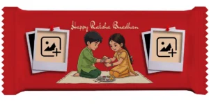 Horizontal festive red Upahar18 Nestlé KitKat cover featuring a customize design with twin blank Polaroid photo chocolate frames pinned with red tacks, a central cartoon sibling art, and English Happy Raksha Bandhan text.